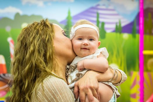 mother and child play in the children's room