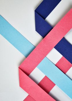 abstract background composition of colored paper ribbons