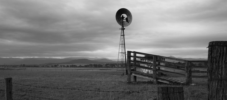 Windmill in the countryside of Queensland, Australia. Black and White.