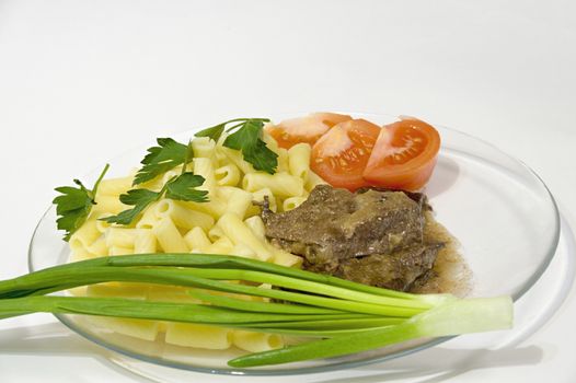 grilled beef liver with pasta sauce onions and tomatoes on a plate