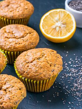 Muffins with chia seeds and lemon. Homemade muffins on black background