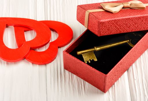 Gift by St. Valentine's Day in a red box on a white background