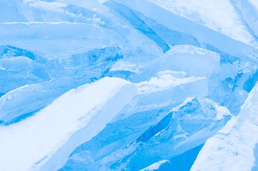 Winter scene at a frozen lake with ice-pack and other ice formations