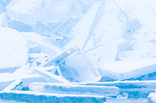 Winter scene at a frozen lake with ice-pack and other ice formations