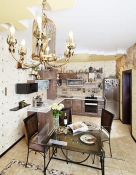 Beautiful wooden kitchen with dinner table and chairs in yellow colors