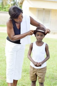 This young woman is wearing a hat to her son.