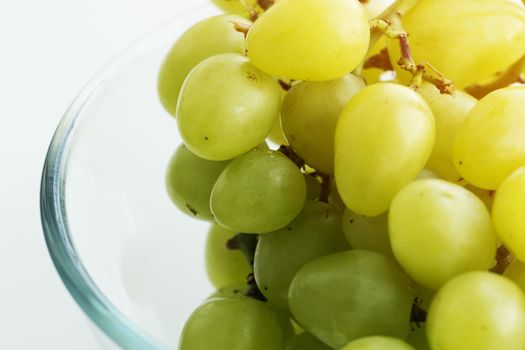 bunch of grapes in a glass bowl. white grape in a glass bowl