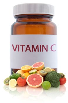 Vitamin c rich foods with a medicine pill jar in the background 