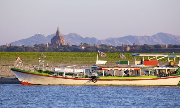 Boats and pagoda in Bagan , Myanmar