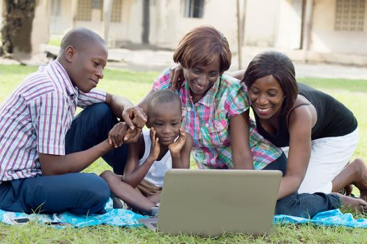 This family is very happy in front of the laptop because it’s find s things very interesting.
