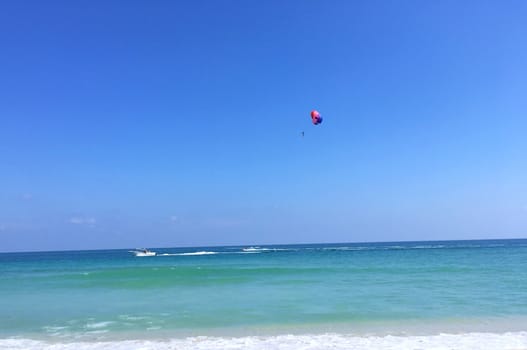 Parasailing and blue sky. Summer vacation and travel adventure concept.