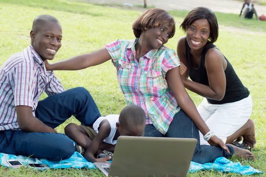 This family is very happy in front of the laptop because it’s find s things very interesting .