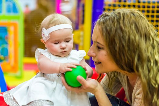 mother and child play in the children's room