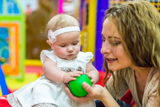 mother and child play in the children's room