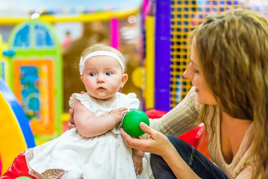 mother and child play in the children's room