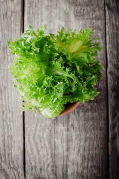 Fresh green lettuce on  a wooden table