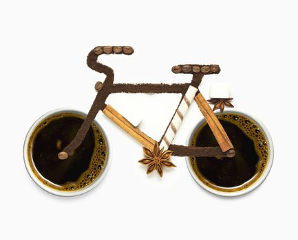 Creative concept photo of  a bicycle made of coffee beans and cups as wheels on white background.