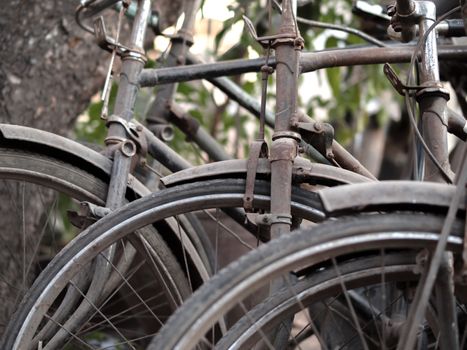 COLOR PHOTO OF ABSTRACT SHOT OF OLD RUSTY BICYCLE PARTS