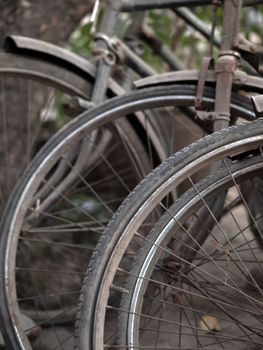 COLOR PHOTO OF ABSTRACT SHOT OF OLD RUSTY BICYCLE PARTS