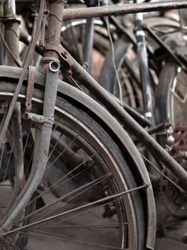 COLOR PHOTO OF ABSTRACT SHOT OF OLD RUSTY BICYCLE PARTS