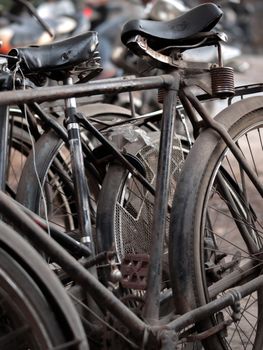 COLOR PHOTO OF ABSTRACT SHOT OF OLD RUSTY BICYCLE PARTS