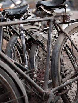 COLOR PHOTO OF ABSTRACT SHOT OF OLD RUSTY BICYCLE PARTS