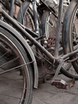 COLOR PHOTO OF ABSTRACT SHOT OF OLD RUSTY BICYCLE PARTS