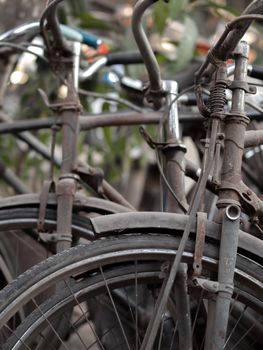 COLOR PHOTO OF ABSTRACT SHOT OF OLD RUSTY BICYCLE PARTS