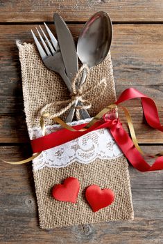 Cutlery set inside pouch with silk ribbon and a gift box