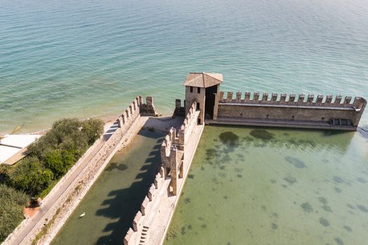 The fortress walls of Castello Scaligero in Sirmione on Lake Garda in Italy