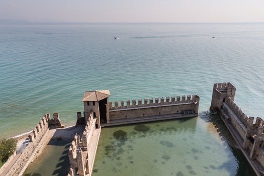 The fortress walls of Castello Scaligero in Sirmione on Lake Garda in Italy