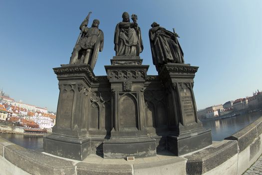 Sculpture from 1853 on Charles bridge - St. Norbert, Wenceslas and Sigismund. Founder Premonstrates - St. Norbert - displayed in a bishop's miter with clothing as elevates the monstrance. On the sides patron Prince Wenceslas with the flag and the Burgundian king Sigismund with the crown and sword.