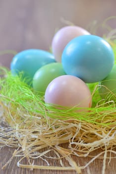 Colorful easter eggs isolated in ornamental nest
