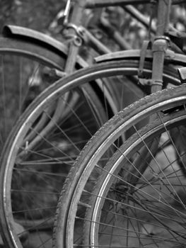 BLACK AND WHITE PHOTO OF ABSTRACT SHOT OF OLD RUSTY BICYCLE PARTS