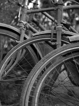 BLACK AND WHITE PHOTO OF ABSTRACT SHOT OF OLD RUSTY BICYCLE PARTS