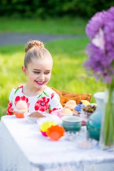 beautiful girl has breakfast in the Green Garden