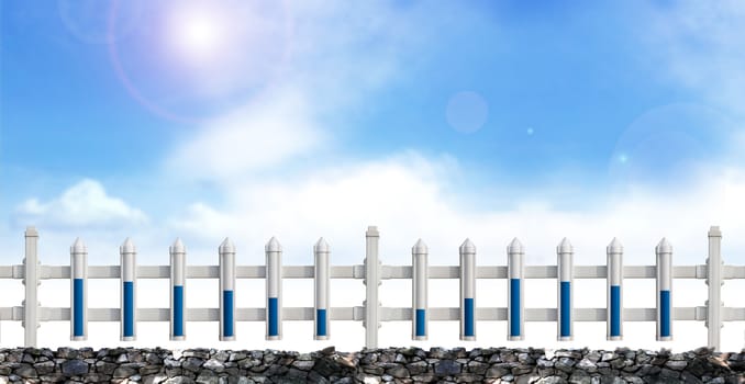 A row of white fence in the blue sky