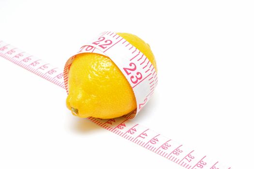 Lemon and Tape measures isolated on white background