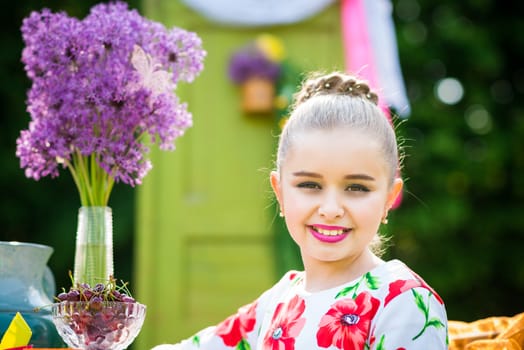 beautiful girl has breakfast in the Green Garden