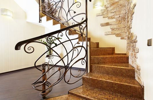 Classical mosaic stairs with ornamental handrail and stone decors 