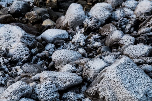 Frozen rocks with frost over them