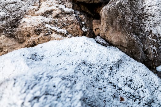 Frozen rocks with frost over them