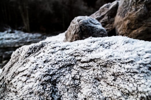 Frozen rocks with frost over them