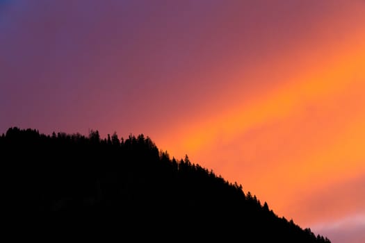 orange and purple sky with silhouette foreground