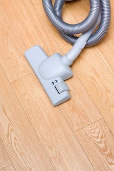 Vacuum cleaner on wood floor