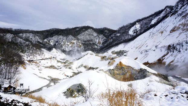 Noboribetsu onsen hell valley snow winter landscape national park in Jigokudani, Hokkaido, Japan