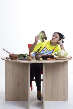 Housewife is preparing in the kitchen on a white background