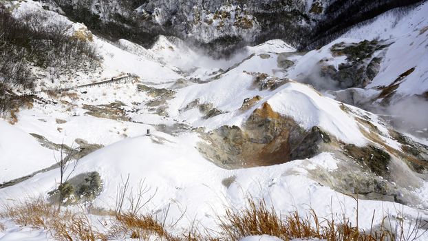 Noboribetsu onsen snow winter landscape hell valley closeup national park in Jigokudani, Hokkaido, Japan
