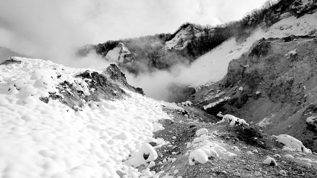 Noboribetsu onsen snow winter national park monochrome in Jigokudani, Hokkaido, Japan