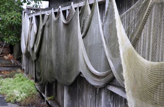 Fishing nets drying on the fence